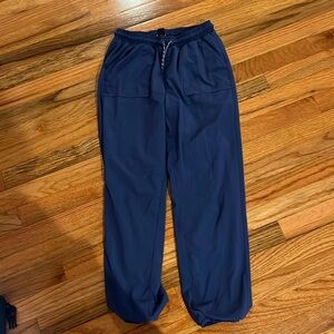 Blue pants kind of scrubs feeling with 2 pockets and string to make tighter